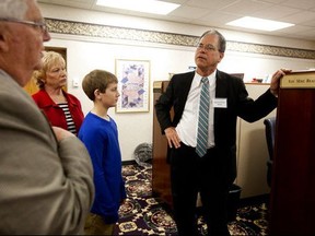 In this March 24, 2015, photo, State Rep. Mike Braun, R-Jasper, right, shows Marvin and Vicky Eisenhut, of Haysville, Ind., and their grandson Cooper Uebelhor of Ferdinand, 12, his office at the Indiana Statehouse in Indianapolis. The little-known but independently wealthy Indiana state lawmaker is plunging roughly $800,000 into his GOP Senate primary bid. Braun says he also raised another $200,000 from donors during the fundraising quarter that ended Sept. 30.  (The Herald via AP)