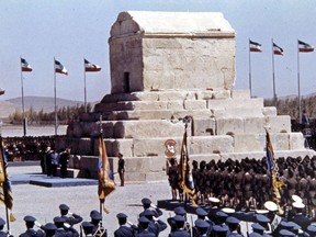 FILE -- In this Oct. 12, 1971 file photo, honor guards line up during ceremonies to mark the 2,500 anniversary of the founding of the Persian Empire at the Tomb of Cyrus the Great, at Pasargad, Iran. The Iranian judiciary's news agency Mizan reported Sunday, Oct. 29, 2017, that it has foiled an online plot led by foreigners to spark dissent involving the tomb on the day that many mark the birth of the Persian king. (AP Photo, File)