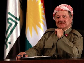 FILE - In this Sept. 24, 2017 file photo, the President of Iraq's autonomous Kurdish region, Massoud Barzani, speaks to reporters during a press conference in Irbil, Iraq. A Kurdish official said Sunday, Oct. 29, 2017, that Barzani, has informed parliament that he'll not stay in office as his term expires Nov. 1 in the wake of a controversial vote on independence from Iraq. (AP Photo/Khalid Mohammed, File)