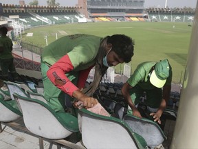 Preparations are in progress at the Gaddafi stadium for the coming Pakistan Sri Lanka T20 cricket match, in Lahore, Pakistan, Wednesday, Oct. 25, 2017. (AP Photo/K.M. Chaudary)
