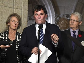 Minister of Fisheries, Oceans and the Canadian Coast Guard Dominic LeBlanc makes an announcement on protection measures for the Southern Resident Killer Whale, as Liberal MP Joyce Murray and Minister of Transport Marc Garneau look on, in the Foyer of the House of Commons on Parliament Hill, in Ottawa on Thursday, Oct. 26, 2017. THE CANADIAN PRESS/Justin Tang