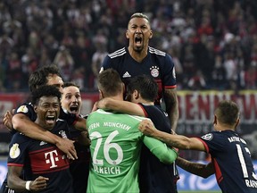 Bayern's team celebrate after winning the German soccer cup, DFB Pokal, match between the first divisioners RB Leipzig and FC Bayern Munich in Leipzig, Germany, Wednesday, Oct. 25, 2017. Bayern won by 6-5 after penalty kicks. (AP Photo/Jens Meyer)