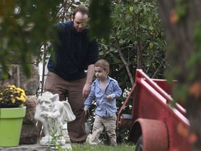 Joshua Boyle and his son Jonah play in the garden at his parents house in Smiths Falls, Ont., on Saturday, Oct. 14, 2017.