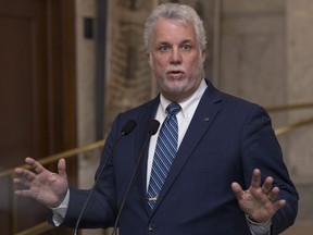 Quebec Premier Philippe Couillard comments on MNA Guy Ouellette, who was recently released after being arrested last week in connection with the disclosure of confidential documents, during a news conference at the National Assembly in Quebec City, Tuesday, October 31, 2017. THE CANADIAN PRESS/Jacques Boissinot
