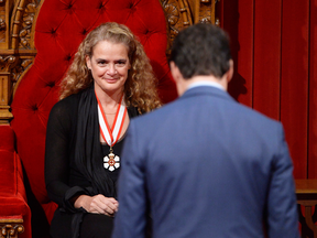 Julie Payette watches as Prime Minister Justin Trudeau bows to her before his speech in the Senate chamber during her installation ceremony as Gvernor General, in Ottawa on Monday, Oct. 2, 2017.