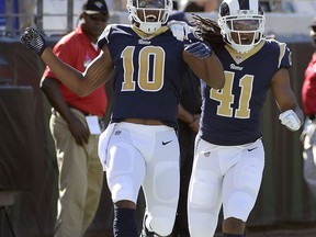 Los Angeles Rams' Pharoh Cooper (10) celebrates his 103-yard touchdown kickoff return against the Jacksonville Jaguars with defensive back Marqui Christian (41)during the first half of an NFL football game, Sunday, Oct. 15, 2017, in Jacksonville, Fla. (AP Photo/Phelan M. Ebenhack)
