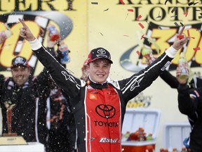 Christopher Bell celebrates after winning the NASCAR Xfinity Series auto race at Kansas Speedway in Kansas City, Kan., Saturday, Oct. 21, 2017. (AP Photo/Colin E. Braley)