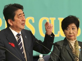 Ruling Liberal Democratic Party leader and Japan's Prime Minister Shinzo Abe, left, speaks as Party of Hope leader Yuriko Koike, listens during their debate for the Oct. 22 lower house election in Tokyo, Sunday, Oct. 8, 2017. (AP Photo/Koji Sasahara)