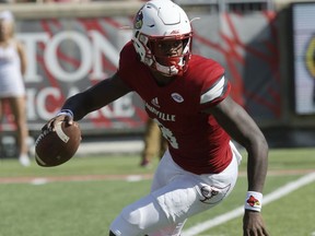Louisville quarterback Lamar Jackson (8) scrambles as he looks for an open receiver during the second half of an NCAA college football game against Boston College, Saturday, Oct. 14, 2017, in Louisville, Ky. Boston College won 45-42. (AP Photo/Timothy D. Easley)
