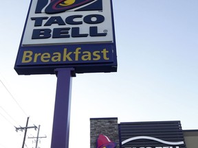 FILE - This Dec. 15, 2016, file photo shows a Taco Bell restaurant in Metairie, La. Robert L. McKay, who designed the first Taco Bell restaurant and with founder Glenn Bell turned it from a quirky food stand into a fast-food empire, died last week. He was 86. (AP Photo/Gerald Herbert, File)