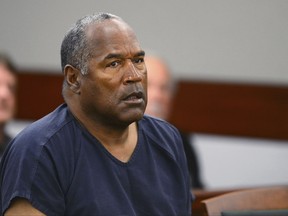 FILE - In this May 14, 2013, file photo, O.J. Simpson appears at an evidentiary hearing in Clark County District Court in Las Vegas. A Nevada prison official said early Sunday, Oct. 1, 2017, O.J. Simpson, the former football legend and Hollywood star, has been released from a Nevada prison in Lovelock after serving nine years for armed robbery. (Ethan Miller via AP, Pool, File)