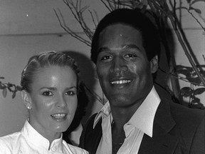 FILE - In this May 6, 1980, file photo, former football star O.J. Simpson and friend, Nicole Brown get together at party Monday night, in Beverly Hills section of Los Angeles. The couple attended introduction party for a new geometric puzzle invented in Hungary and being distributed here as "Rubik's Cube." A Nevada prison official said early Sunday, Oct. 1, 2017, O.J. Simpson, the former football legend and Hollywood star, has been released from a Nevada prison in Lovelock after serving nine years for armed robbery. (AP Photo/Nick Ut, File)