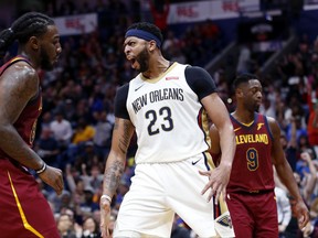 New Orleans Pelicans forward Anthony Davis (23) reacts after his slam dunk in the second half of an NBA basketball game against the Cleveland Cavaliers in New Orleans, Saturday, Oct. 28, 2017. The Pelicans won 123-101. (AP Photo/Gerald Herbert)