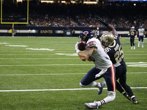 EDS NOTE: GRAPHIC CONTENT - Chicago Bears tight end Zach Miller (86) injures his leg as pulls in a touchdown reception, that was ruled incomplete upon review, as New Orleans Saints defensive back Rafael Bush (25) covers, in the second half of an NFL football game in New Orleans, Sunday, Oct. 29, 2017. (AP Photo/Butch Dill)