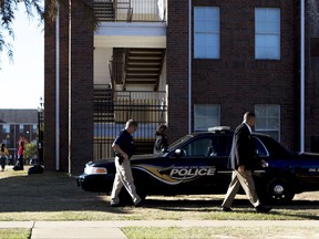 Grambling State University Police work the scene of a shooting in Grambling, La., Wednesday, Oct. 25, 2017.  Authorities said a student and his friend were fatally shot after an altercation that began in a dorm room and ended in a courtyard at the historically black university in northern Louisiana.  (Hannah Baldwin/The News-Star via AP)