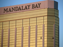Drapes billow out of broken windows at Stephen Paddock's room at the Mandalay Bay resort and casino in Las Vegas.