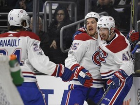 Montreal Canadiens left wing Paul Byron, right, celebrates his goal with right wing Andrew Shaw, center, and center Phillip Danault during the first period of an NHL hockey game against the Los Angeles Kings, Wednesday, Oct. 18, 2017, in Los Angeles. (AP Photo/Mark J. Terrill)