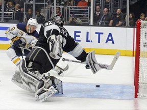 Buffalo Sabres center Zemgus Girgensons (28) scores on Los Angeles Kings goalie Jonathan Quick (32) during the first period of an NHL hockey game in Los Angeles Saturday, Oct. 14, 2017. (AP Photo/Reed Saxon)