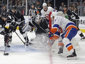 New York Islanders center Jordan Eberle (7), right, and Los Angeles Kings goalie Darcy Kuemper (35) battle at the goal in the first period of an NHL hockey game in Los Angeles, Sunday, Oct. 15, 2017. (AP Photo/Reed Saxon)