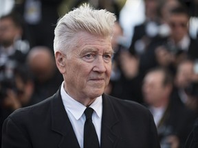 FILE - In Tuesday, May 23, 2017 file photo, David Lynch poses for photographers upon arrival at the 70th Anniversary of the film festival, Cannes, southern France. American director David Lynch will be honored with a lifetime achievement award at the upcoming Rome Film Fest which opens Oct. 26, 2017. (Photo by Arthur Mola/Invision/AP, File)