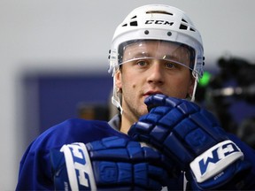 In this Sept. 7 file photo, Toronto Maple Leafs defenceman Morgan Rielly takes a break at a pre-training camp workout.