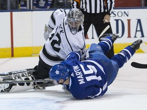 Matt Martin of the Toronto Maple Leafs is down, but manages to get the puck past Los Angeles Kings' goaltender Jonathan Quick during NHL action Monday night in Toronto. The Leafs were 3-2 winners.