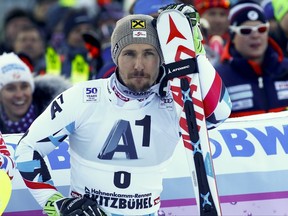 FILE - In this Jan. 22, 2017 file photo Austria's Marcel Hirscher waits in the finish area during an alpine ski, men's World Cup slalom, in Kitzbuehel, Austria. Multiple World Cup Overall winner Hirscher broke his left ankle during a training on Moelltaler glacier in Austria, Thursday, Aug. 17, 2017. While injuries have forced many of ski racing's biggest names including Hirscher to sit out the season-opening World Cup events this weekend, American standout Lindsey Vonn surprisingly announced her start in Saturday's giant slalom. (AP Photo/Giovanni Auletta, file)