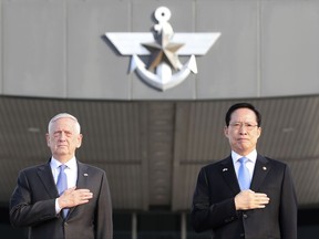 U.S. Defense Secretary Jim Mattis, left, and South Korean Defense Minister Song Young-moo salute during a welcome honor guard ceremony at Defense Ministry in Seoul, South Korea, Saturday, Oct. 28, 2017. (AP Photo/Lee Jin-man)