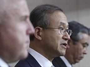 South Korean Vice Foreign Minister Lim Sung-nam, center, answers reporter's question as U.S. Deputy Secretary of State John Sullivan, left, and Japanese Deputy Foreign Minister Shinsuke Sugiyama listen during a press conference following their meeting at the Foreign Ministry in Seoul, South Korea, Wednesday, Oct. 18, 2017. (AP Photo/Lee Jin-man, Pool)