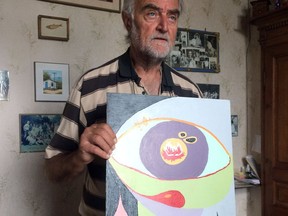 In this Monday, June 26, 2017 photo, Pierre Pol Vincke poses with a painting by his daughter, Edith, in Ramillies, Belgium. Belgium is one of few countries that allow euthanasia but doctors refused his daughter's request despite years of psychiatric illness, and Edith eventually ended her own life on Nov. 3, 2011. (AP Photo/Maria Cheng)