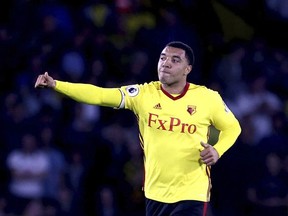 Watford's Troy Deeney celebrates scoring his side's first goal of the game from the penalty spot during their English Premier League soccer match at Vicarage Road, Watford, England, Saturday, Oct. 14, 2017. (Steven Paston/PA via AP)