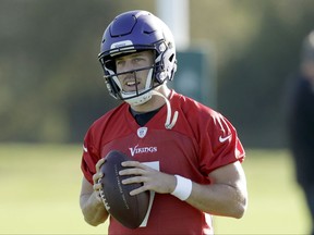 Minnesota Vikings quarterback Case Keenum takes part in an NFL training session at the London Irish rugby team training ground in the Sunbury-onThames suburb of south west London, Friday, Oct. 27, 2017. The Minnesota Vikings are preparing for an NFL regular season game against the Cleveland Browns in London on Sunday. (AP Photo/Matt Dunham)