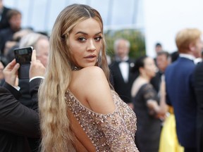 FILE - In this file photo dated Tuesday, May 23, 2017, singer Rita Ora poses for photographers upon arrival at the 70th Anniversary of the Cannes Film Festival, in Cannes, southern France.  A mass of top acts are slated to perform during the upcoming MTV European Music Awards, with Rita Ora due to host the Nov. 12, 2017, ceremony in London. (AP Photo/Thibault Camus, FILE)