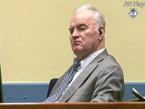 FILE - This is a Monday Dec. 5, 2016 file photo taken from video of former Bosnian Serb military chief General Ratko Mladic as he looks across the court room at the International Criminal Tribunal for the Former Yugoslavia in the Hague Netherlands. Serbia says former Bosnian Serb military commander Ratko Mladic, who is being tried for genocide at a U.N. tribunal, can be released provisionally on health grounds from detention in The Hague, Netherlands. The state TV said Tuesday Oct. 3, 2017  that the government was responding to requests from the defense and family, stating that 74-year-old Mladic would not flee while undergoing hospital treatment in Serbia.  (ICTY Video via AP File)