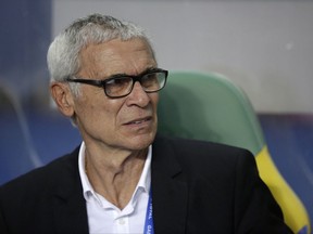 FILE - In this Sunday, Feb. 5, 2017 file photo, Egypt coach Hector Cuper sits on the bench during the African Cup of Nations final soccer match between Egypt and Cameroon at the Stade de l'Amitie, in Libreville, Gabon. Egypt coach Hector Cuper has opened up about the stress he's feeling trying to get Egypt to its first World Cup since 1990. Cuper said he's on medication for high blood pressure. Egypt can qualify, and provide relief for Cuper, if Uganda fails to beat Ghana on Saturday, Oct. 7 and Egypt beats Republic of Congo at home on Sunday. (AP Photo/Sunday Alamba, file)