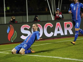Iceland's Gylfi Sigurdsson celebrates after scoring against Kosovo, during the World Cup Group I qualifying soccer match between Iceland and Kosovo in Reykjavik, Iceland, Monday Oct. 9, 2017. (AP Photo/Brynjar Gunnarsson).