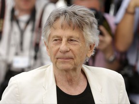 FILE - In this May 27, 2017 photo, director Roman Polanski appears at the photo call for the film, "Based On A True Story," at the 70th international film festival, Cannes, southern France. A film company said Tuesday, Oct. 17, 2017, Oscar-winning director Roman Polanski is in Poland to appear in a documentary about his early life. (AP Photo/Alastair Grant, File)