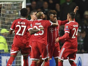 Bayern Munich Kingsley Coman, second right, celebrates scoring during the Champions League group B match between Celtic FC and FC Bayern Munich at Celtic Park, Glasgow, Tuesday Oct. 31, 2017. (AP Photo)