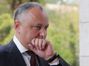 FILE- In this Tuesday, Oct. 10, 2017 file photo, Moldovan President Igor Dodon arrives to meet Russian President Vladimir Putin in the Bocharov Ruchei residence in the Black Sea resort of Sochi, Russia.  Moldova's Constitutional Court said Tuesday, Oct. 27, 2017, that the country's president can be temporarily suspended from his duties after he refused to swear in the defense minister. (Maxim Shemetov/Pool Photo via AP, File)