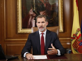In this image released by the Spanish Royal Palace, Spain's King Felipe VI delivers a speech on television from Zarzuela Palace in Madrid, Tuesday, Oct. 3, 2017. Spain's King said that Catalan authorities have deliberately bent the law with "irresponsible conduct" and that the Spanish state needs to ensure constitutional order and the rule of law in Catalonia. (Spain's Royal Palace via AP)