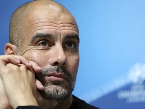 Manchester City manager Pep Guardiola during a press conference at the City Football Academy, Manchester, England Monday Oct. 16, 2017. Manchester City will play Napoli in a Champions League soccer match in Manchester on Tuesday.  (Martin Rickett/PA via AP)