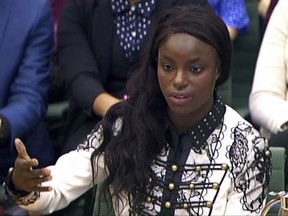 Footballer Eniola Aluko answers questions in front of the Digital, Culture, Media and Sport Committee at Portcullis House in Westminster, London, Wednesday, Oct. 18, 2017. A fresh investigation into the conduct of fired national women's team coach Mark Sampson found that he directed discriminatory comments at players Eniola Aluko and Drew Spence, the English Football Association said Wednesday. (PA via AP)