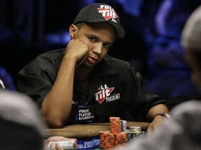 FILE - In this July 15, 2009 file photo, Phil Ivey looks up during the World Series of Poker at the Rio Hotel and Casino in Las Vegas. He's long been a winner at cards, but American poker star Phil Ivey's good fortune does not extend to Britain's Supreme Court, he lost a major case Wednesday, Oct. 25, 2017, that will keep him from cashing in. (AP Photo/Laura Rauch, File)