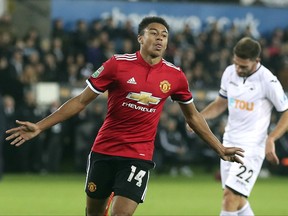 Manchester United's Jesse Lingard celebrates scoring his side's first goal of the game during their English League Cup soccer match against Swansea City at the Liberty Stadium, Swansea, Wales, Tuesday, Oct. 24, 2017. (Nick Potts/PA via AP)