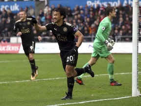 Leicester City's Shinji Okazaki celebrates scoring his side's second goal of the game during the English Premier League soccer match between Swansea City and Leicester City at the Liberty Stadium, Swansea, Wales. Saturday, Oct. 21, 2017.(Nick Potts/PA via AP)