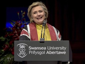US politician Hillary Rodham Clinton delivers a speech during a ceremony where she received a Honorary Doctorate at Swansea University, in recognition of her commitment to promoting the rights of families and children around the world, in Swansea, Wales, Saturday, Oct. 14, 2017. (Ben Birchall/PA via AP)