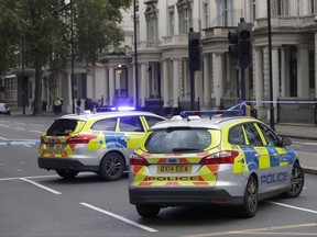 Britain's police cars at the scene of an incident in central London, Saturday, Oct. 7, 2017. London police say emergency services are outside the Natural History Museum in London after a car struck pedestrians. (AP Photo/Kirsty Wigglesworth)