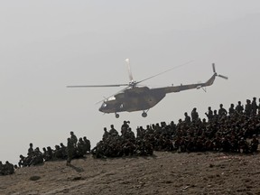 Afghan National Amy soldiers watch during a military exercise in Kabul, Afghanistan, Tuesday, Oct. 17, 2017. (AP Photo/Massoud Hossaini)