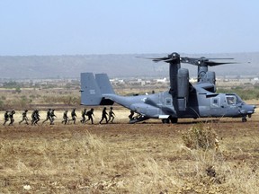 Far from the battlefields of Iraq and Afghanistan,  America's fight against terrorism is unfolding in  remote West Africa. Malian soldiers with a U.S. special forces trainer board a USAF CV-22 Osprey as part of a training exercise in Mali in November 2008.