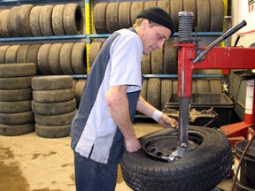 Maurice Thibeault is seen in this January 2016 Postmedia file photo working as a tire technician at Brooks Tire in Chatham